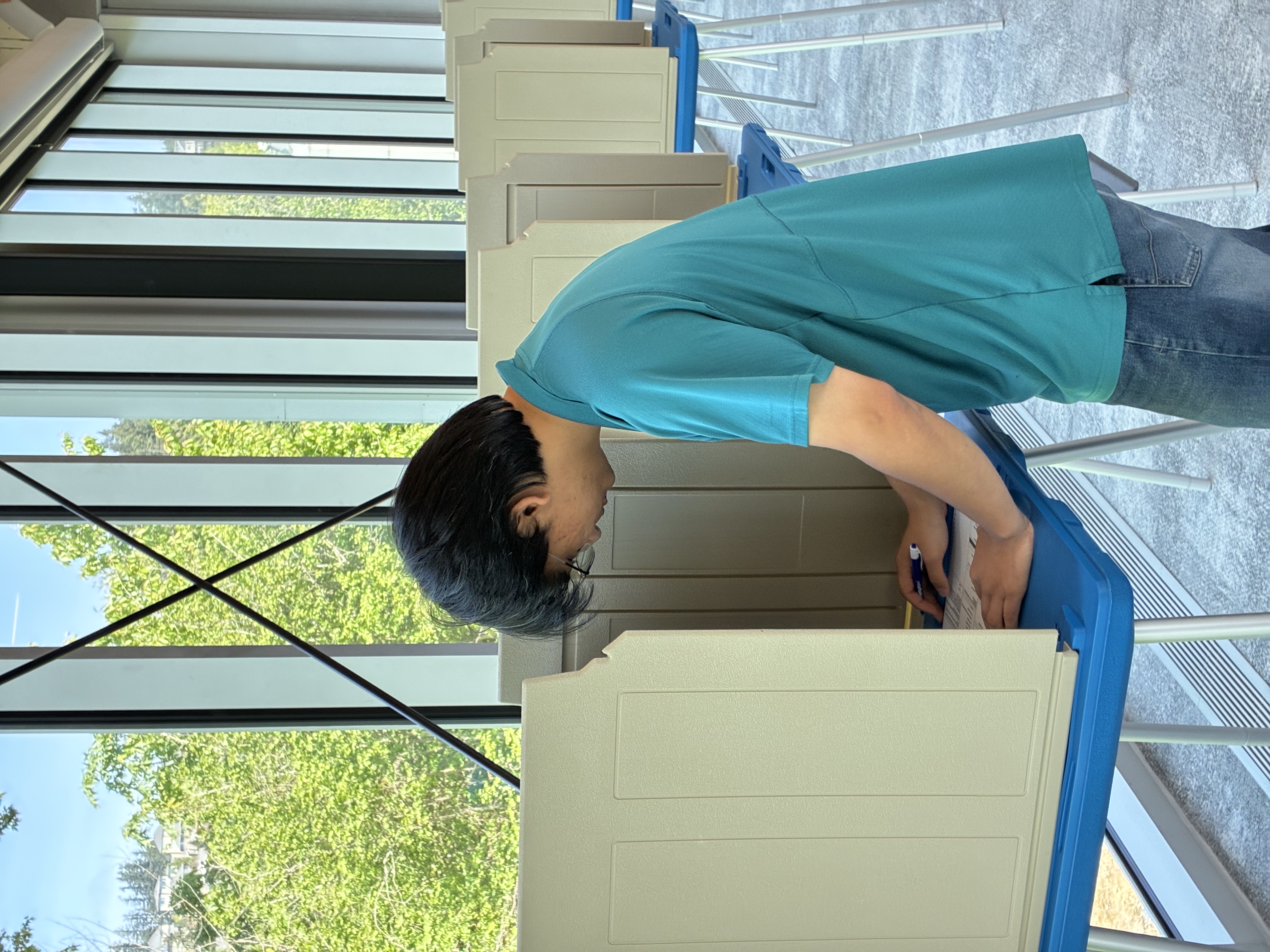 Voter votes at a voting booth at the Happy Valley Vote Center