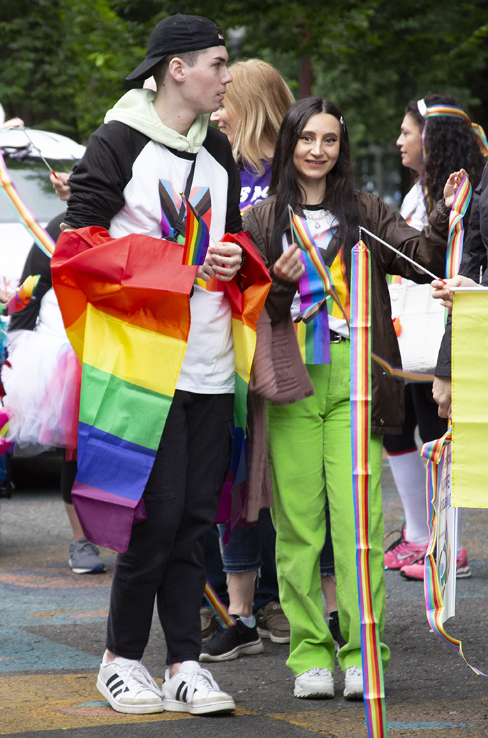 Teenagers walking in the pride parade
