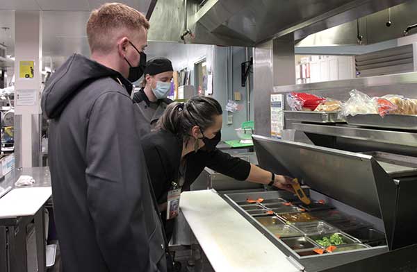 Public Health staff conduct a restaurant inspection