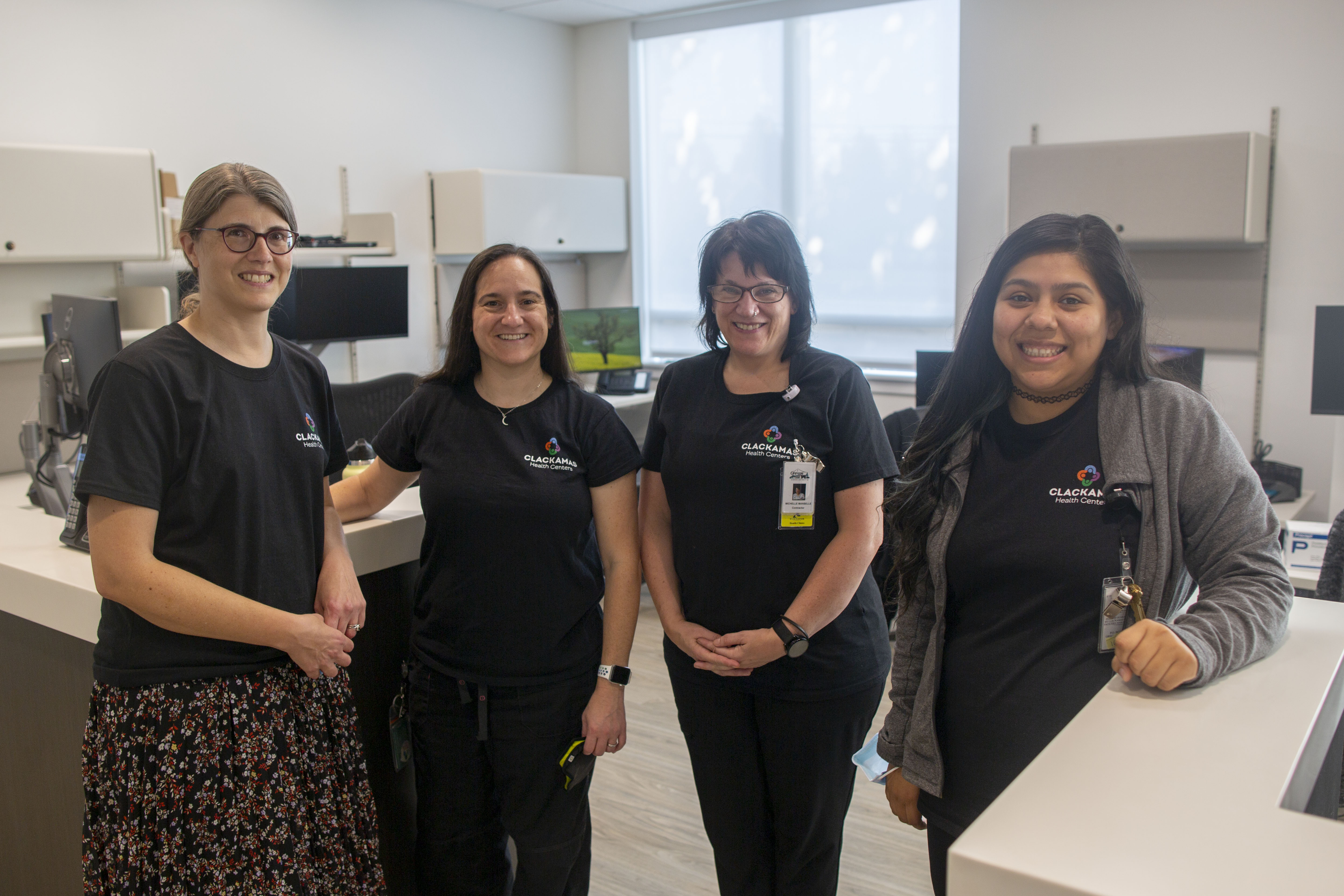 Sandy Health Center staff members celebrate the grand opening of their new patient-friendly clinic.