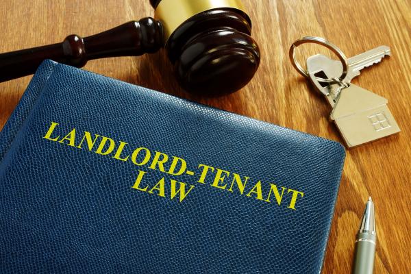 Landlord Tenant Law book and key from home