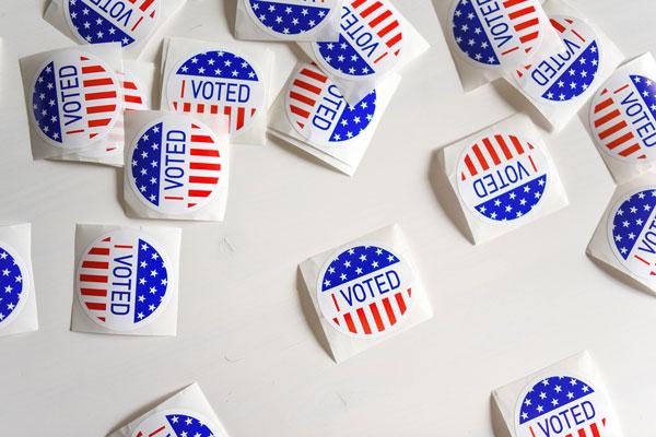 Several "I Voted" stickers laying on a table