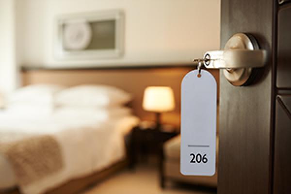 Door opens into motel bedroom
