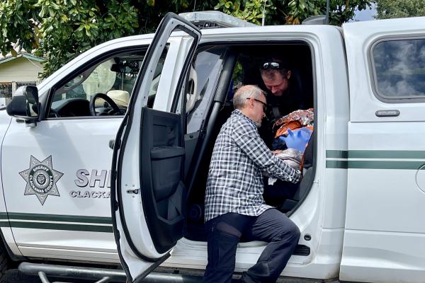 Search and Rescue team comforts found toddler in back of truck