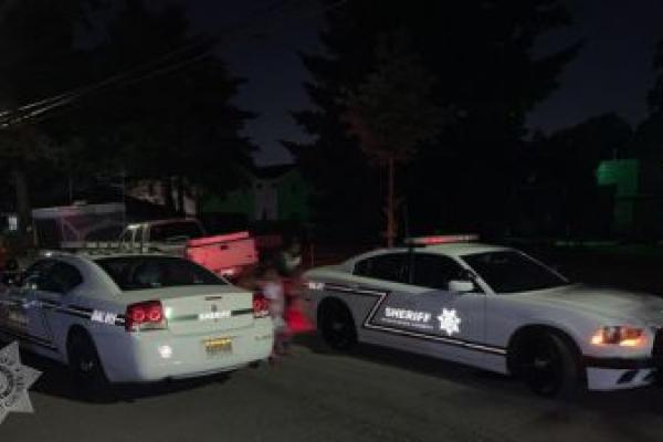 Two CCSO patrol cars parked at the standoff scene.