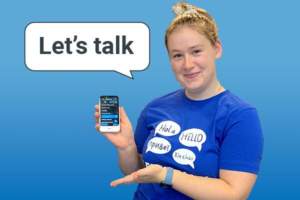 A North Clackamas Aquatic Park employee demonstrates how to use language translation device, Pocketalk.