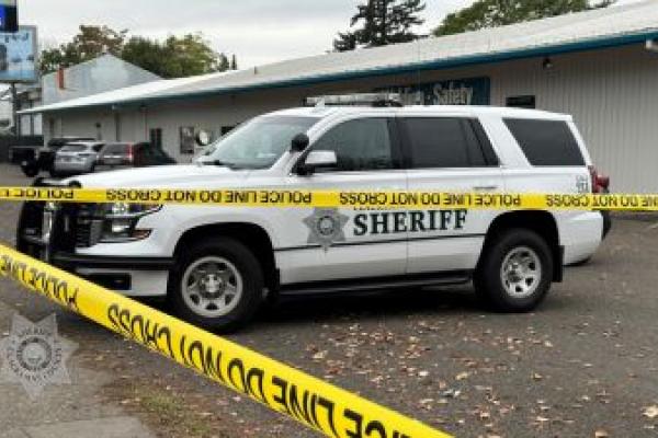 Sheriff's Office vehicle and crime scene tape