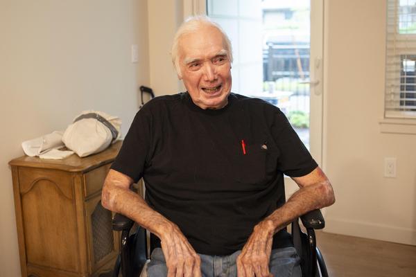 Ray light in wheelchair smiling