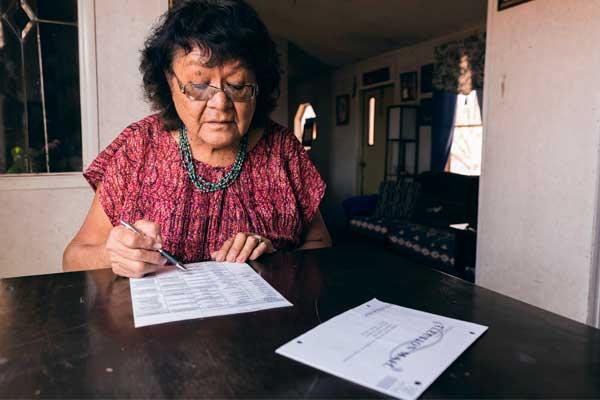 Woman filling out her ballot