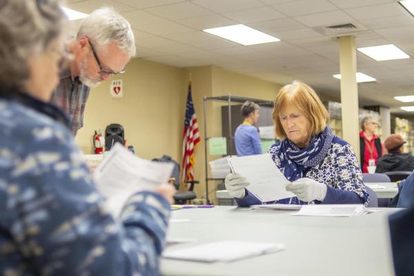 Election workers process ballots on election night.