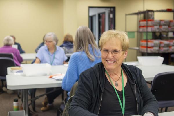 An election worker smiles for the camera on election night.