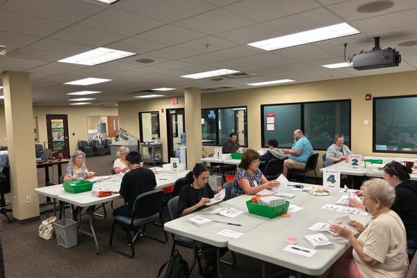 Election workers open ballots at the elections office.