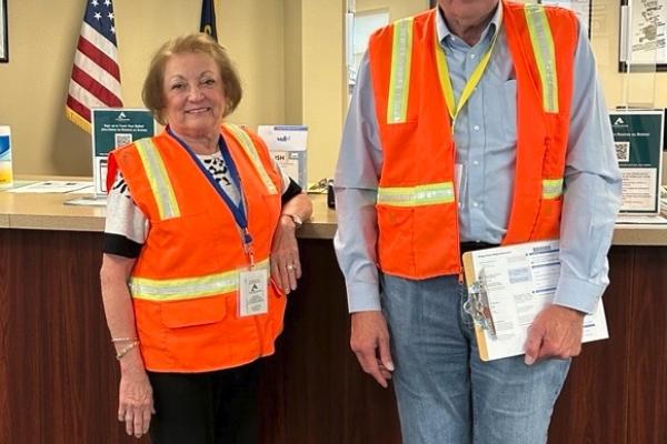 Election workers welcome voters into the Oregon City Office