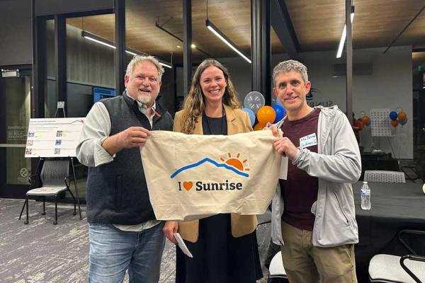 3 people holding an I love Sunrise sign