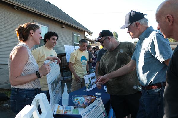 Staff talking to community members