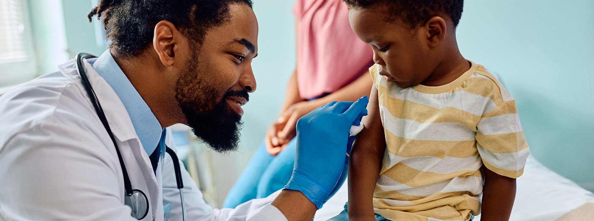 Doctor vaccinating a child
