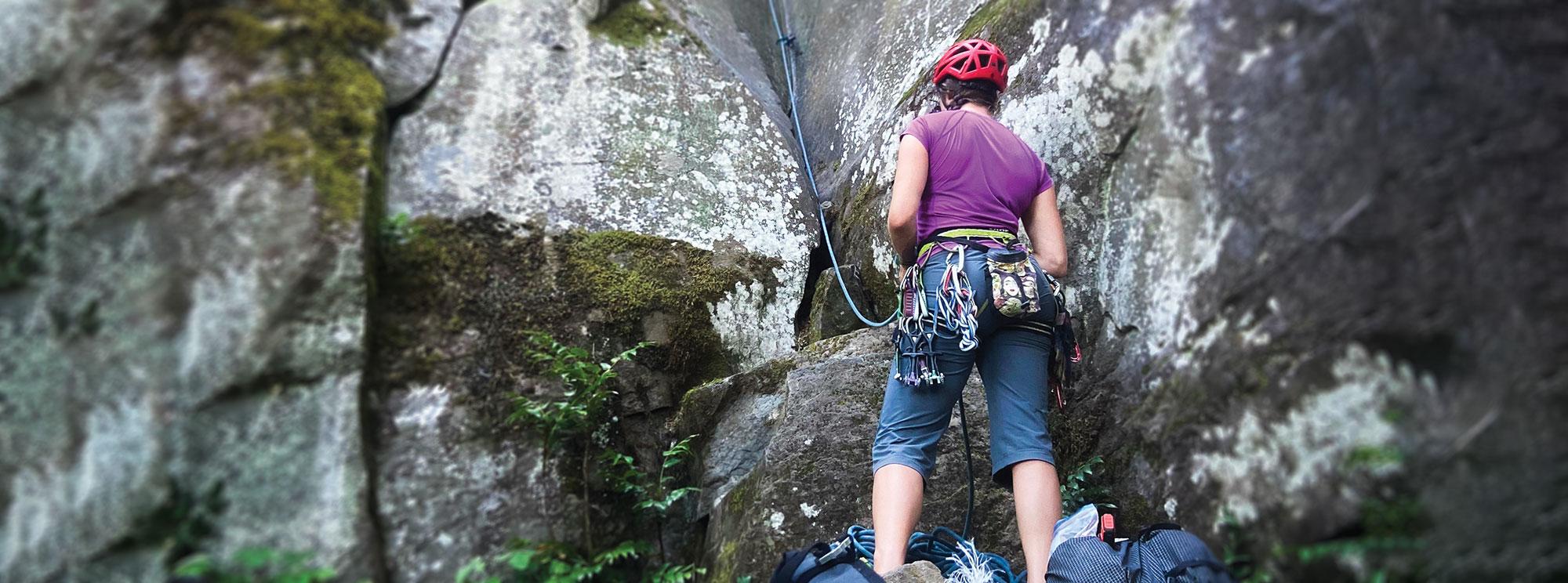 image of woman rock climbing in from of rock face at Madrone Park