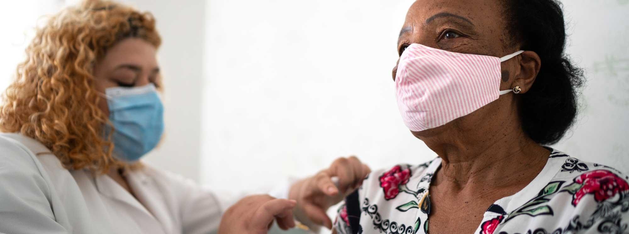 woman getting COVID vaccine