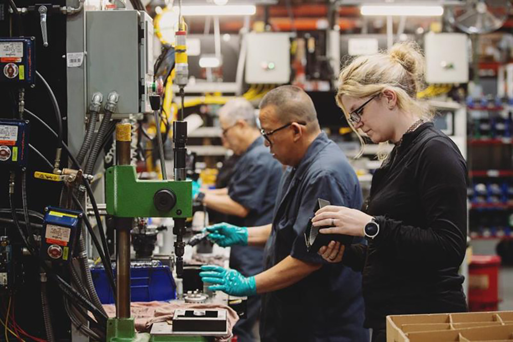Metal workers machining in a workshop