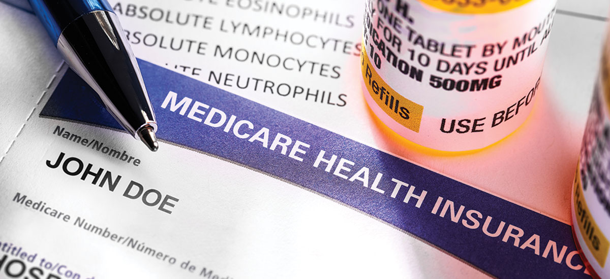 Medicare card and prescription bottle