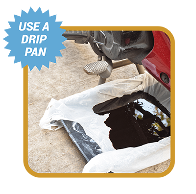 Drip pan under car with words Use a drip pan